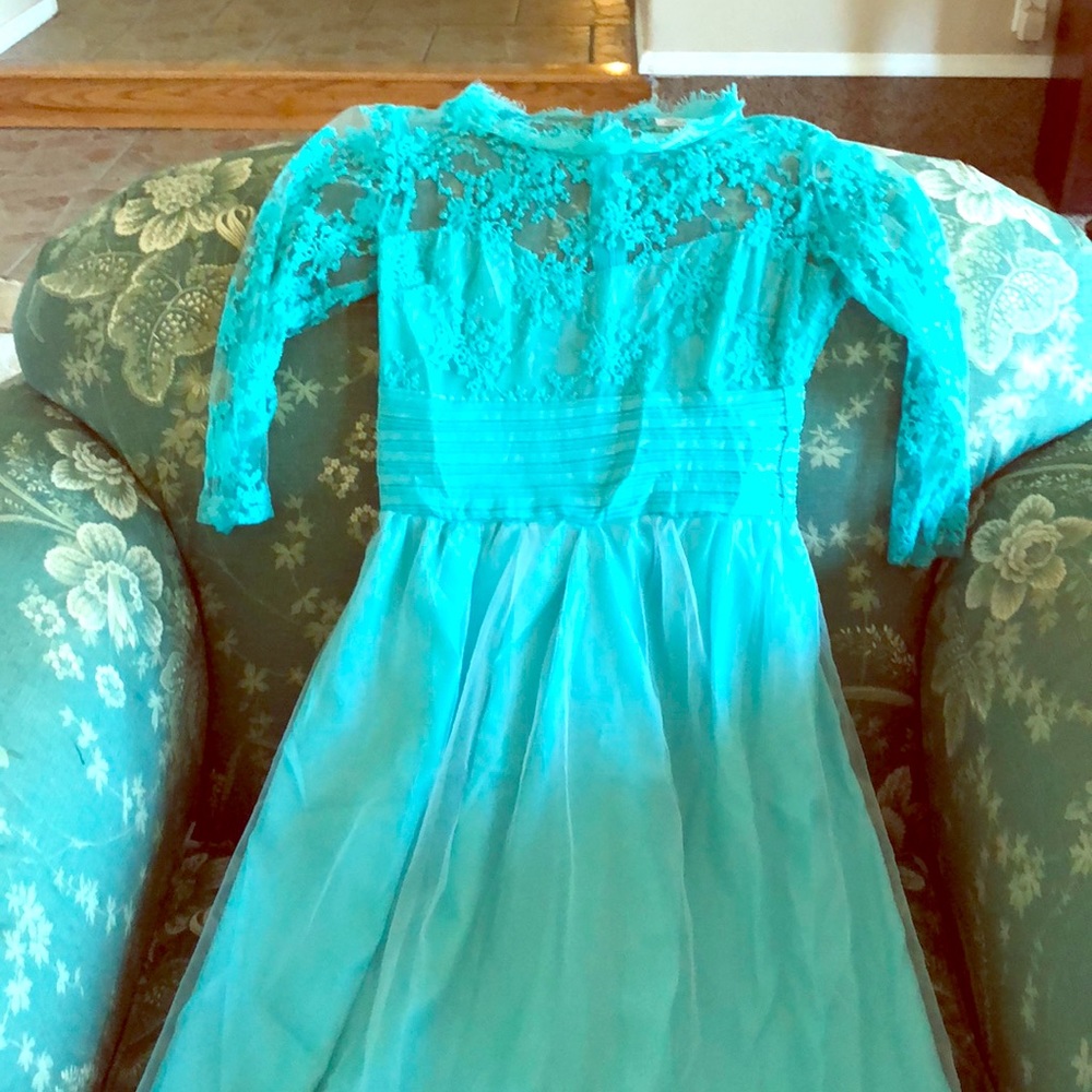 This dress is a long teal beautiful half sleeve,